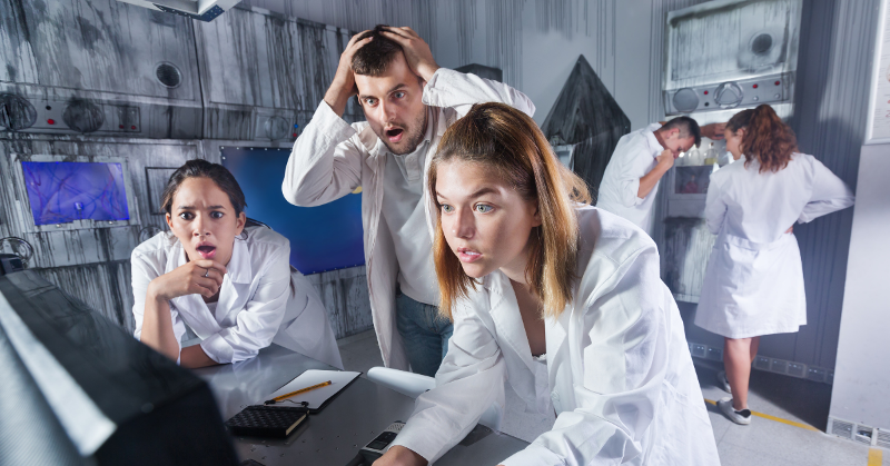5 guests trying to solve an escape room